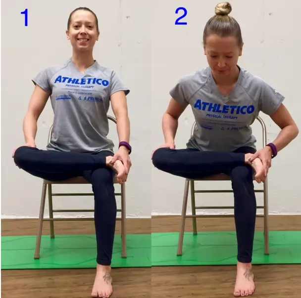Woman performing a seated piriformis test.