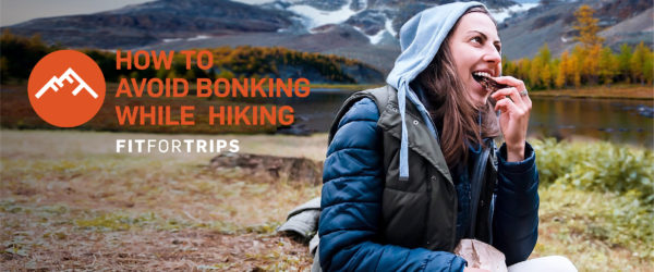 Hiker eating to avoid bonking.