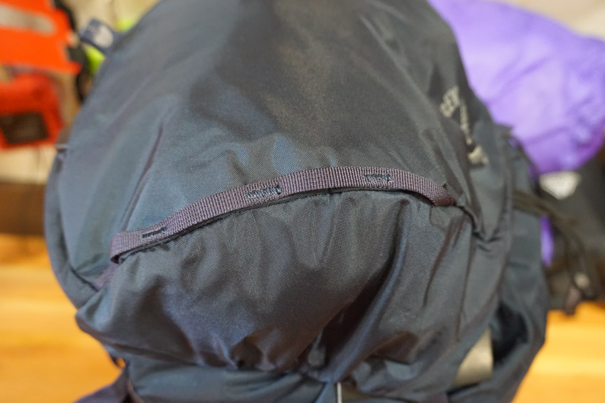 Daisy chain pack lid lashing points on the Osprey Mutant Backpacking Backpack.