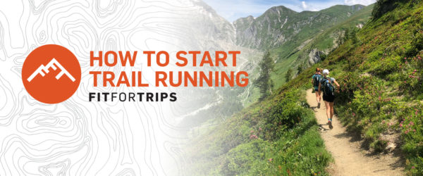 Female trail runners running on mountain trail.