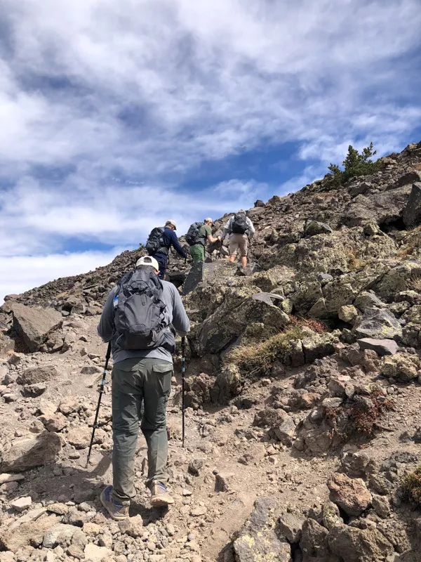 Hikers gaining ridge on steep section of Mount Humphreys.