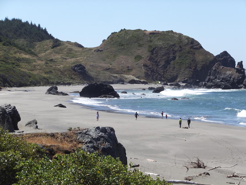 People on Lone Ranch Beach near the end of Oregon Coast Trail.