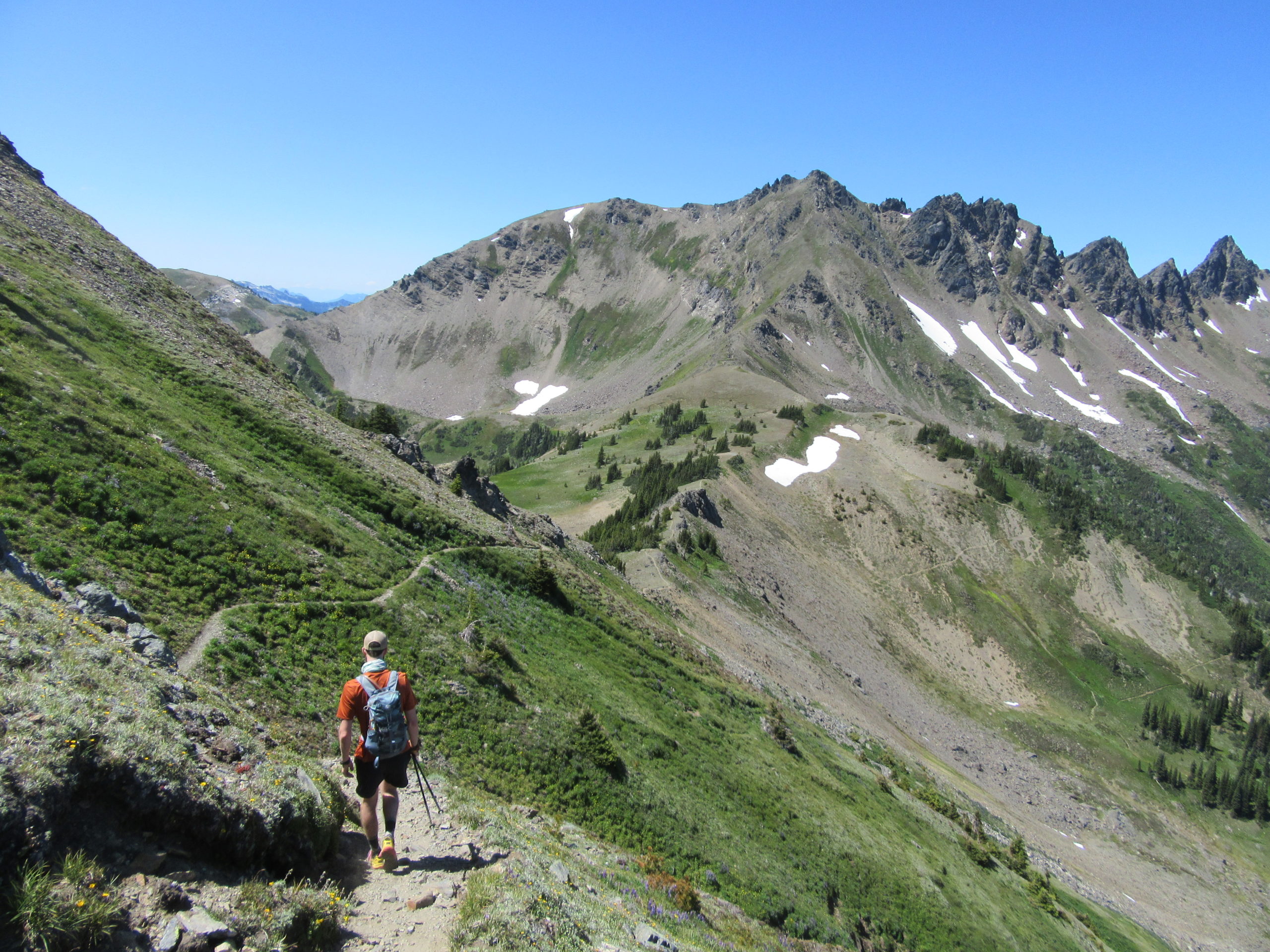 Male hiker hiking Ladies Pass in Alpine Lakes Wilderness.