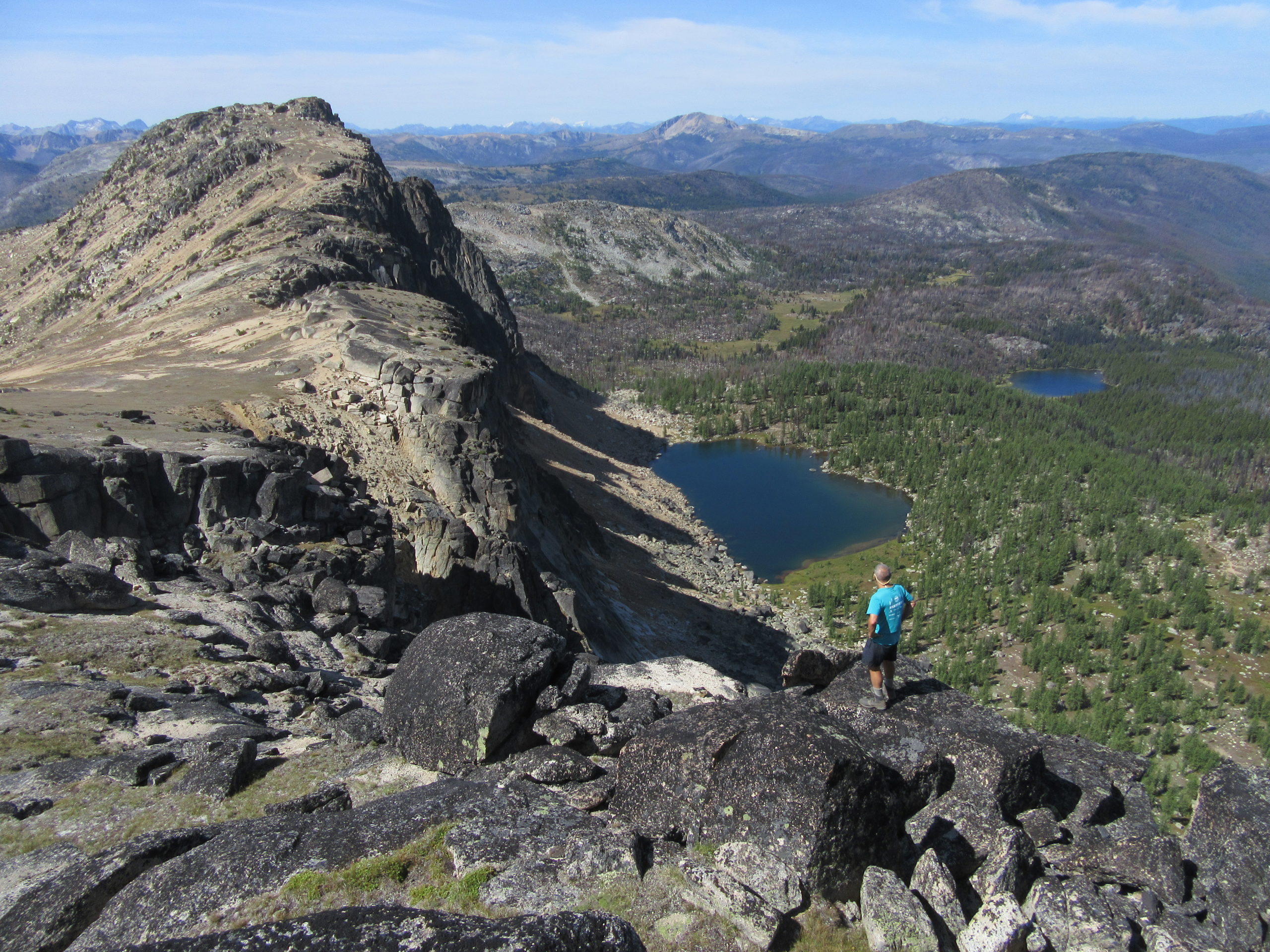 Make hiker overlooking the Cathedral Lakes in Pasayten Wilderness.