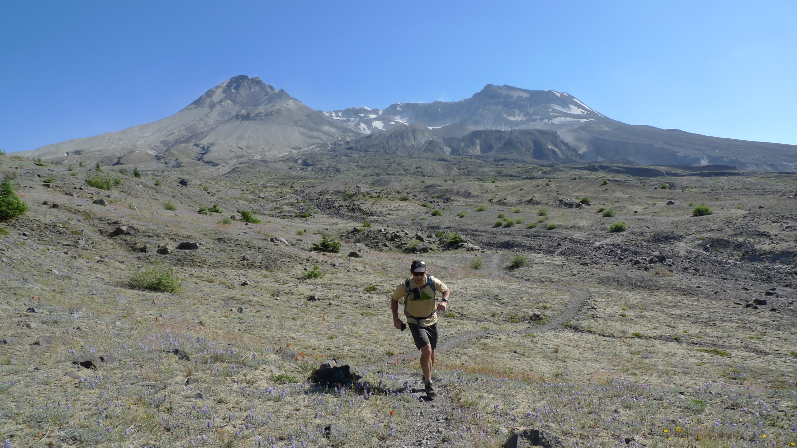 Male trail running the Loowit Trail in Mount St Helens National Volcanic Monument.